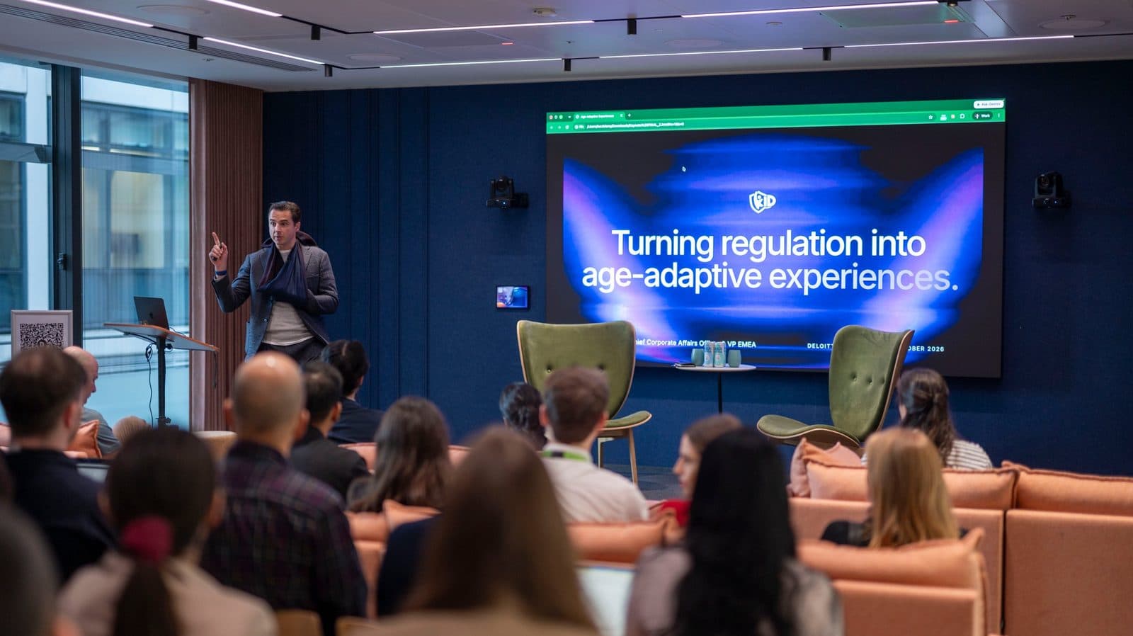 Luc Delany giving a keynote to a seated audience at Deloitte Demo Day
